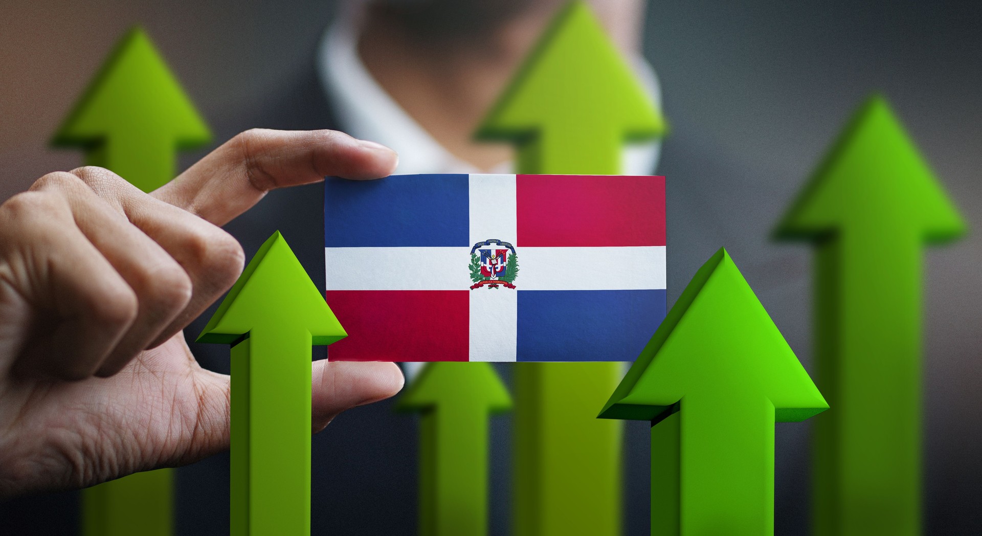 Nation Growth Concept, Green Up Arrows - Businessman Holding Card of Dominican Republic Flag